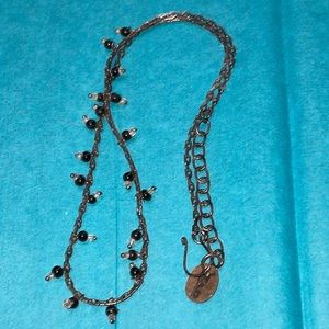 ZAD beaded necklace on black chain with black beads and tag